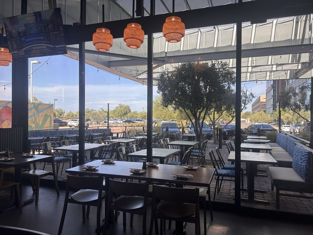 Tables by the windows looking out to the covered patio